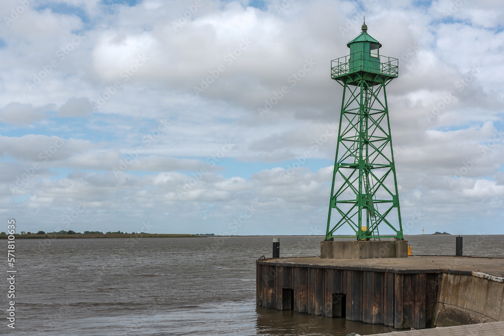 Small green lighthouse at the mouth of the Geeste River in the North Sea, Bremerhaven