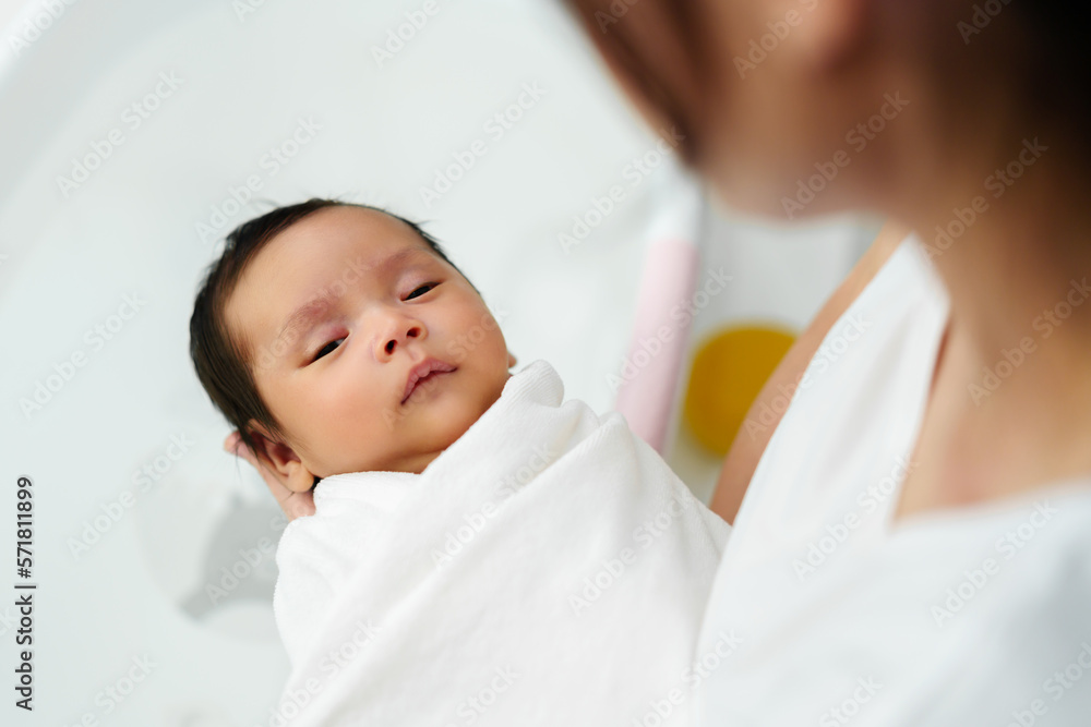 mother prepare to give a bath and wash newborn baby hair in bathtub mother prepare to give a bath and wash newborn baby hair in bathtub