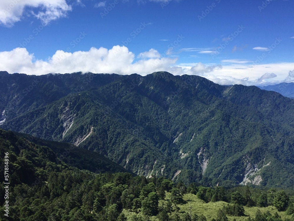 A view of endless mountains at an altitude of 3,000 meters above in summer morning in Kunyang, Hehuanshan, Taiwan.