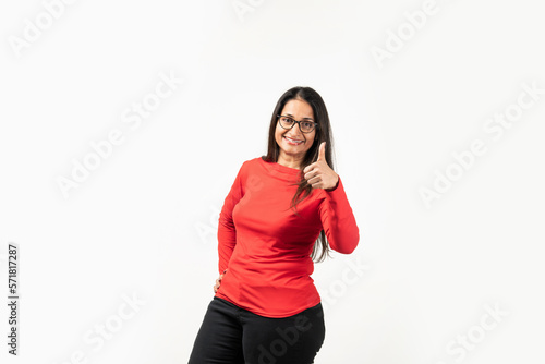 Confident Indian woman showing thumb up in approval, recommending, like something good © StockImageFactory