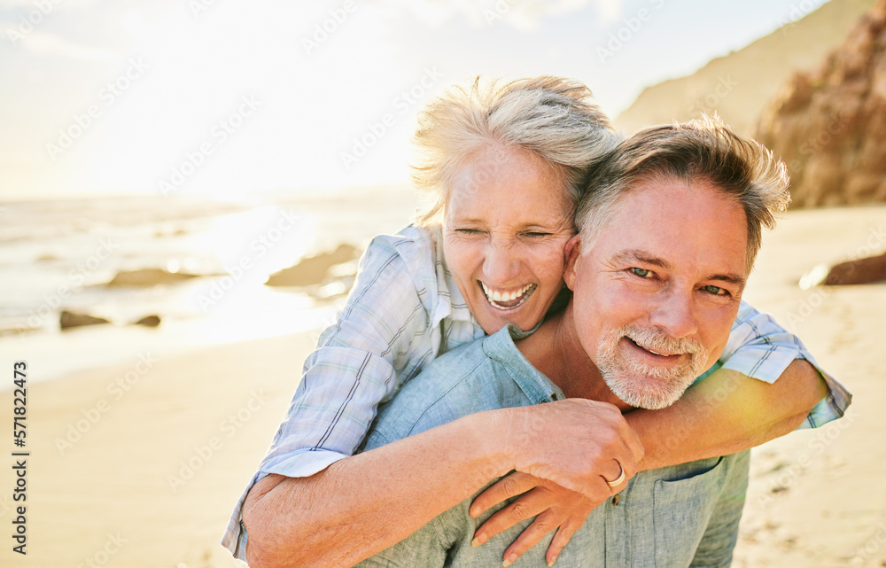 Obraz premium Senior couple, beach and piggyback portrait with smile together, summer and walk for memory, comic time or care. Elderly man, old woman or hug for funny moment, outdoor or sunshine by waves with love