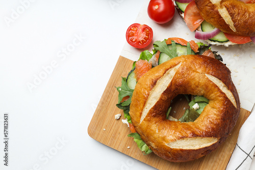 Concept of delicious food - tasty bagel sandwich, space for text