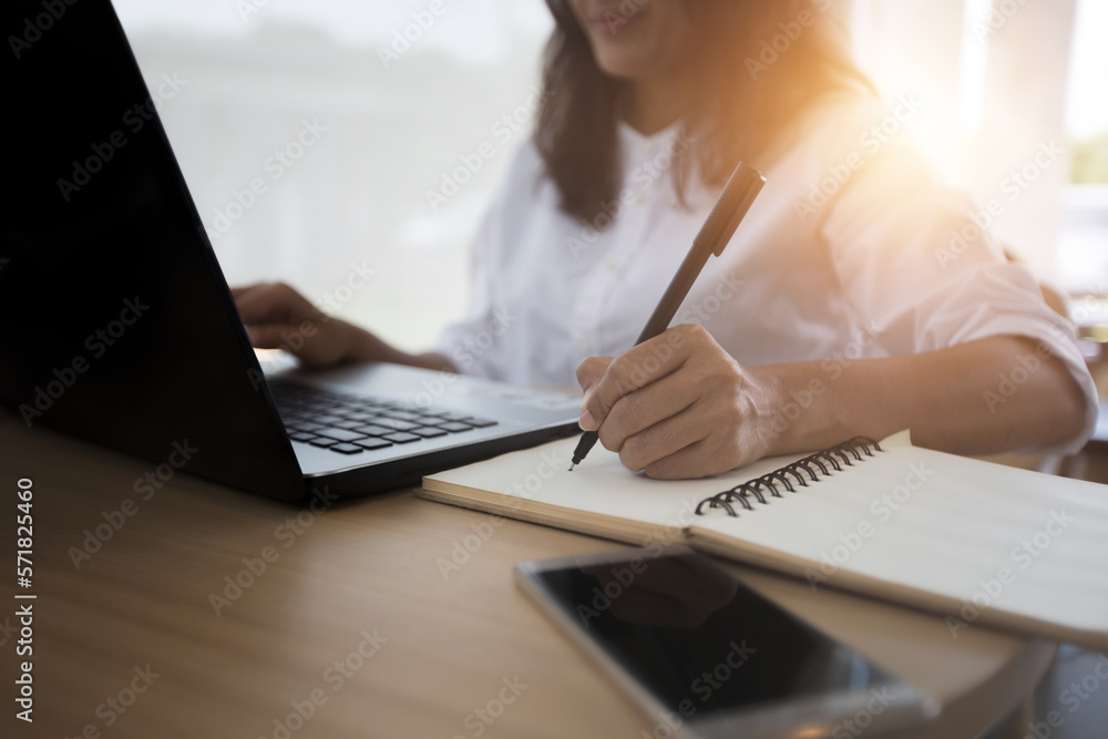 woman at work with learning language during online courses using netbook woman at work with learning language during online courses using netbook