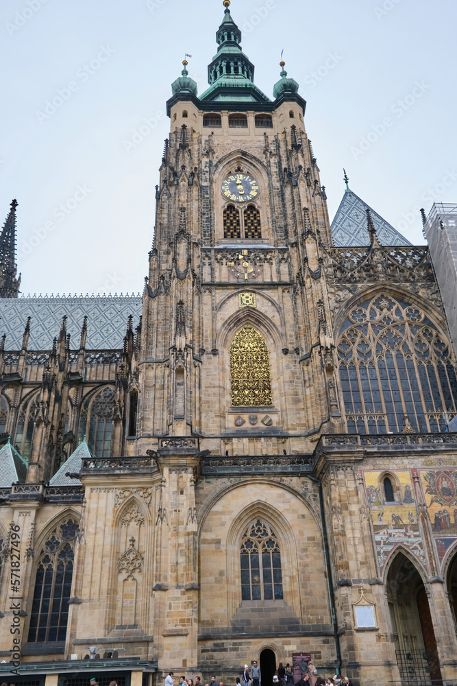 Side view of St. Vitus cathedral Castle in Prague, Czech Republic clock tower, low angle