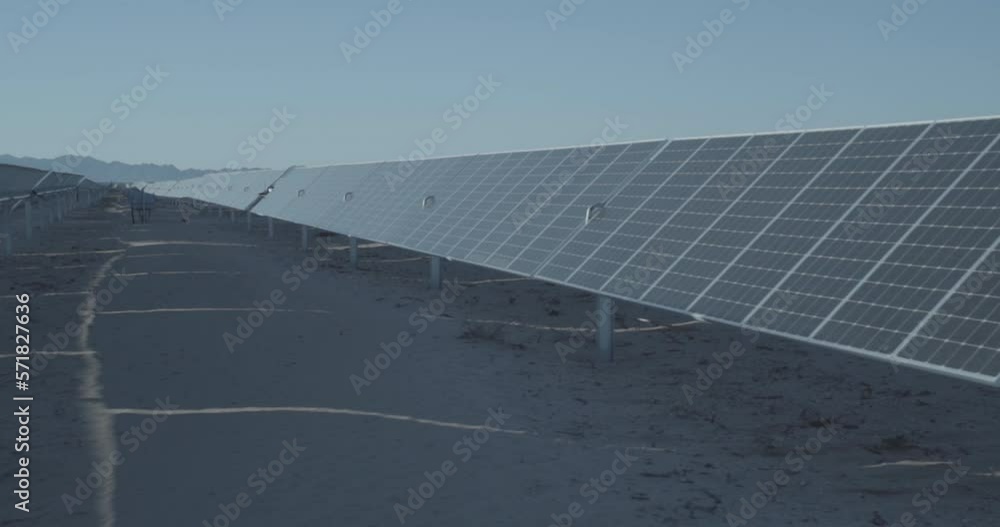 A walk through a solar farm with thousands of solar panels. A walk through a solar farm with thousands of solar panels.