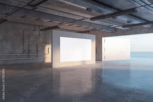 Fototapeta Naklejka Na Ścianę i Meble -  Perspective view on blank white poster with empty place on grey partition in spacious underground hall with water pipes on wall background and glossy concrete floor. 3D rendering, mock up