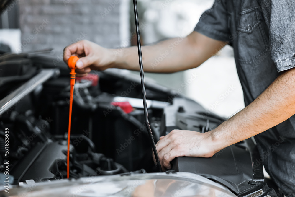 Auto mechanic working in garage. Repair service.
Auto mechanic working in garage. Repair service.