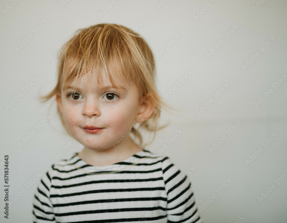 portrait of toddler against white background portrait of toddler against white background