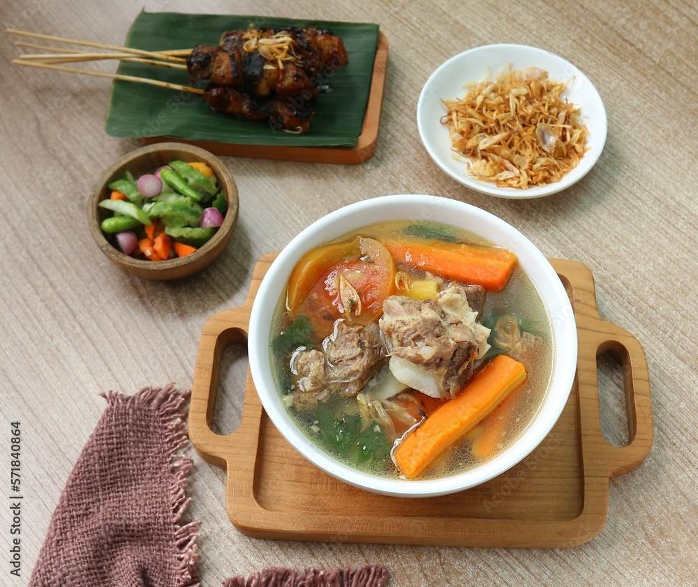 a bowl of beef rib soup with carrots a bowl of beef rib soup with carrots
