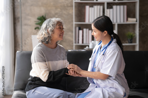 Asian female doctor is comforting and counseling a patient to relieve concerns about the disease.