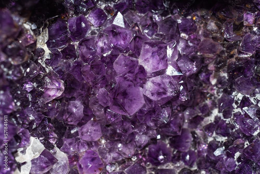 Horisontal background made of amethyst mineral close up Horisontal background made of amethyst mineral close up