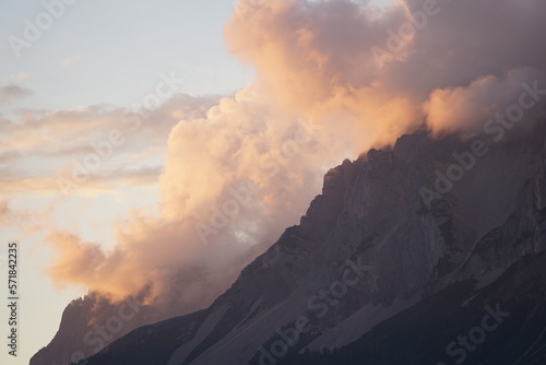 Colorful sunset with some clouds over the mountains. Wonderful scenery with copy space for text