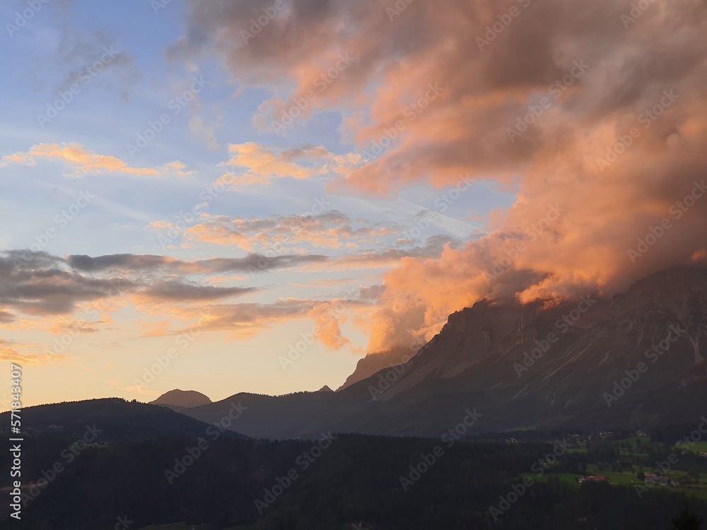 Beautiful colorful sunset over the mountains in Schladming with view to distinctive famous Dachstein mountain in Styria, Austria Beautiful colorful sunset over the mountains in Schladming with view to distinctive famous Dachstein mountain in Styria, Austria