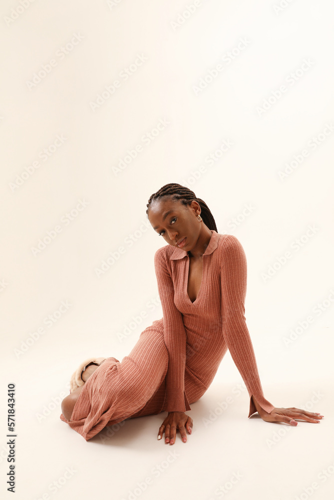 Obraz premium Young woman looking at the camera posing indoor. Vertical mock-up. Isolated.