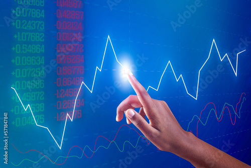 Businessman hand pointing finger to growth success finance business chart. financial graph investment diagram on analysis stock market background with digital economy exchange.