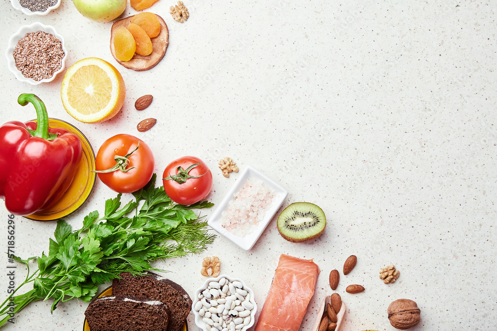 Aesthetics low FODMAP diet with copy space in center. Fruits,vegetables, greenery, nuts, beans, flax seeds, chia seeds, wholegrain bread. Flat lay Aesthetics low FODMAP diet with copy space in center. Fruits,vegetables, greenery, nuts, beans, flax seeds, chia seeds, wholegrain bread. Flat lay