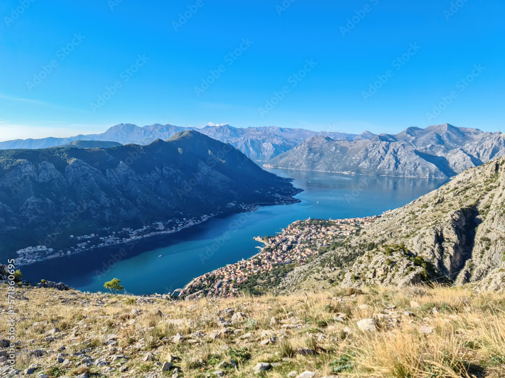 Panoramic view of the bay of Kotor in summer, Adriatic Mediterranean Sea, Montenegro, Balkan Peninsula, Europe. Fjord winding along the coastal towns. Lovcen and Orjen mountain range, Dinaric Alps