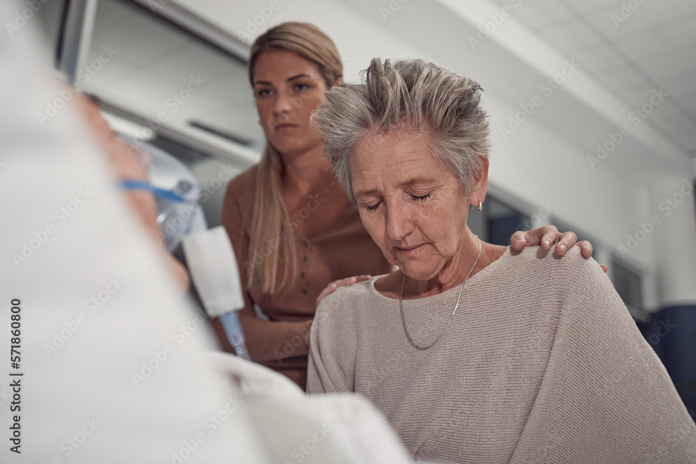 Obraz premium Sad woman visit her sick husband in hospital with the support and comfort from their daughter. Healthcare, love and senior female sitting and praying with her ill man with cancer in a medical clinic.