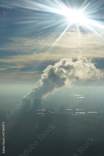 View of a nuclear power plant from air with a sunstar