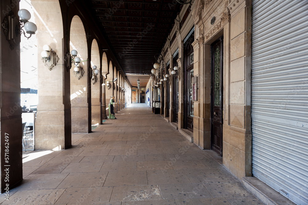 Arched colonnade by the historic Plaza del Castillo square in Old Town, Pamplona