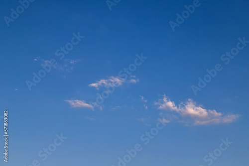 Blue clear sky, few clouds. Blue sky with a few clouds background.