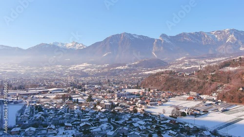 Albertville, France: Aerial view of  French City in Alps (Savoie Alps) mountains in winter, sunny day with clear sky - landscape panorama of Europe from above photo