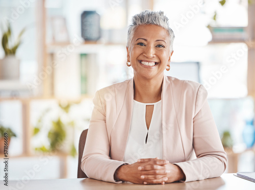 Photography Leadership, portrait and business woman in her office sitting at a desk of a corporate company