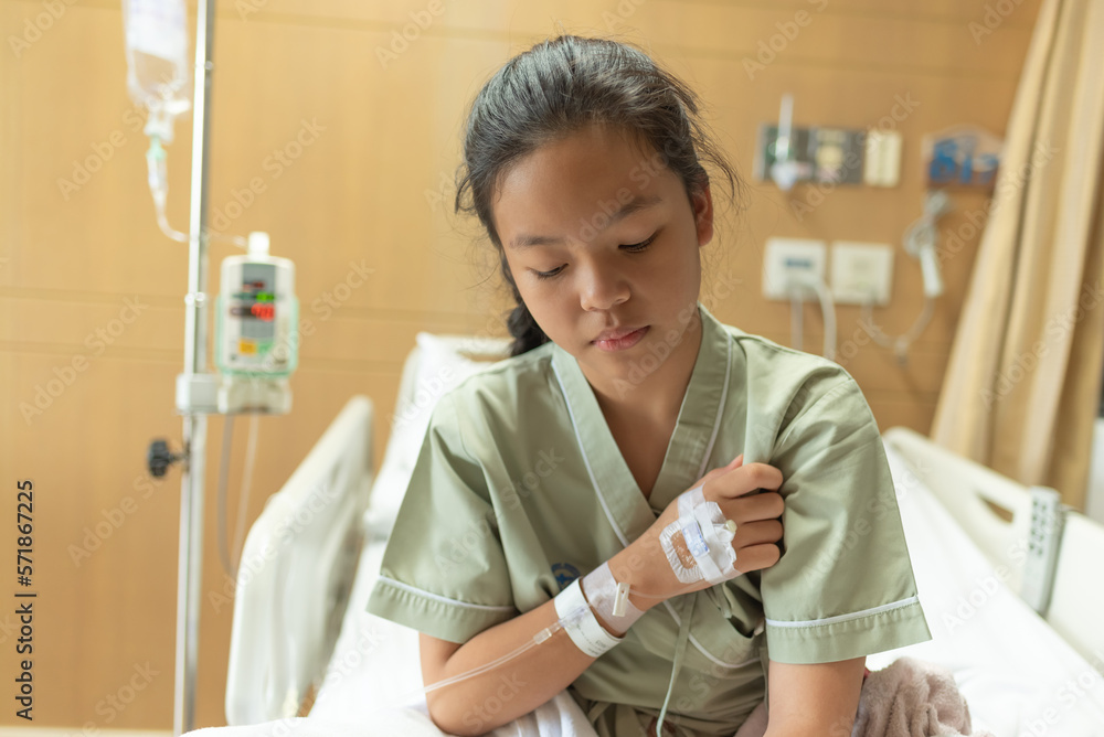teenager sick and in pain and uses his hands to squeeze his chest chest