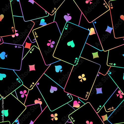 Pattern with playing cards. Multi-colored playing cards scattered on the table on a black background. Suits of playing cards. Spades, Hearts, Clubs, Diamonds.