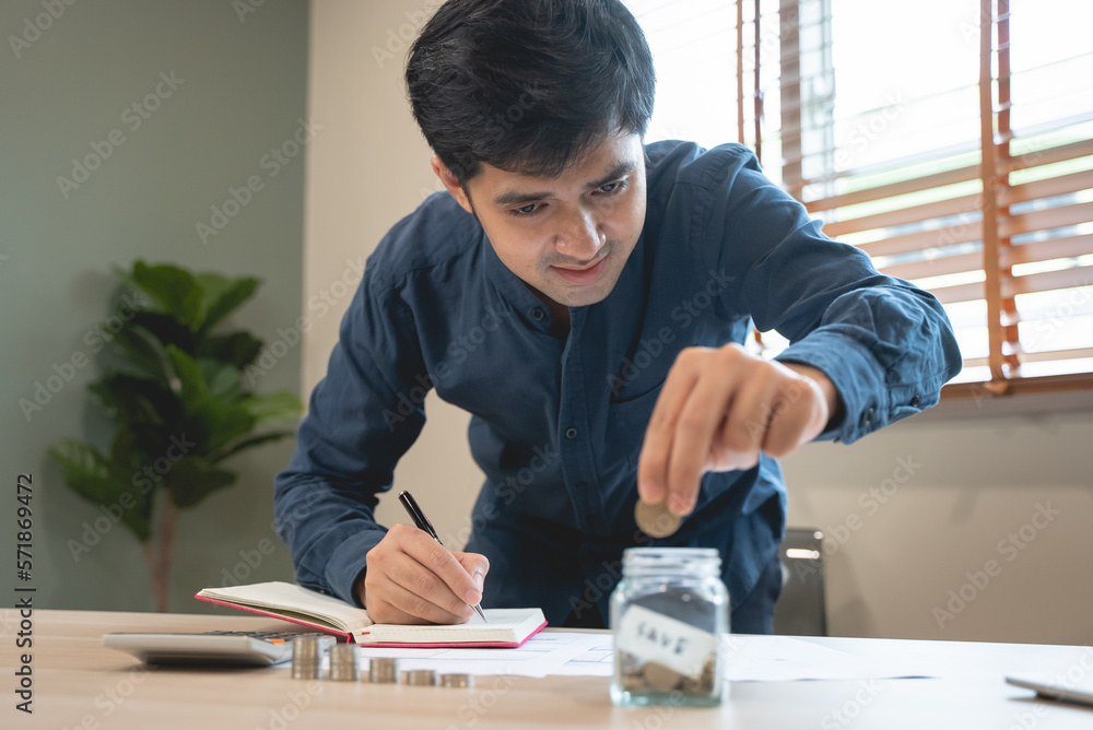 the person putting coin into piggy bank to save money and invest for growth in future.