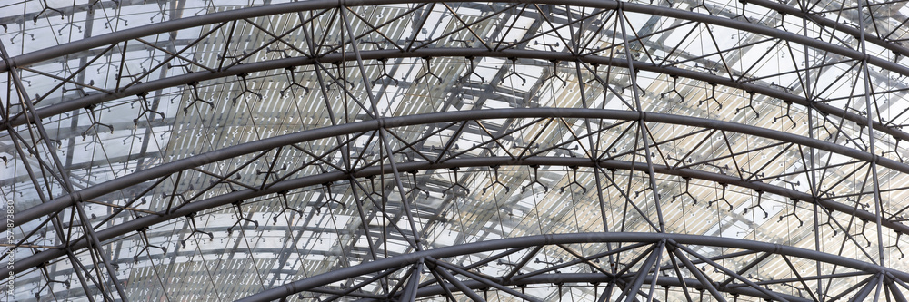 Panoramic image. Iron construction with glass. Roof of a modern building