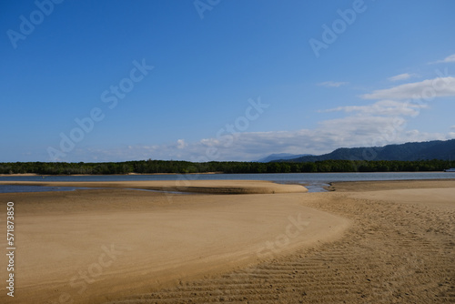 Beautiful Beach view with clouds, rocks and in the jungle  © koen
