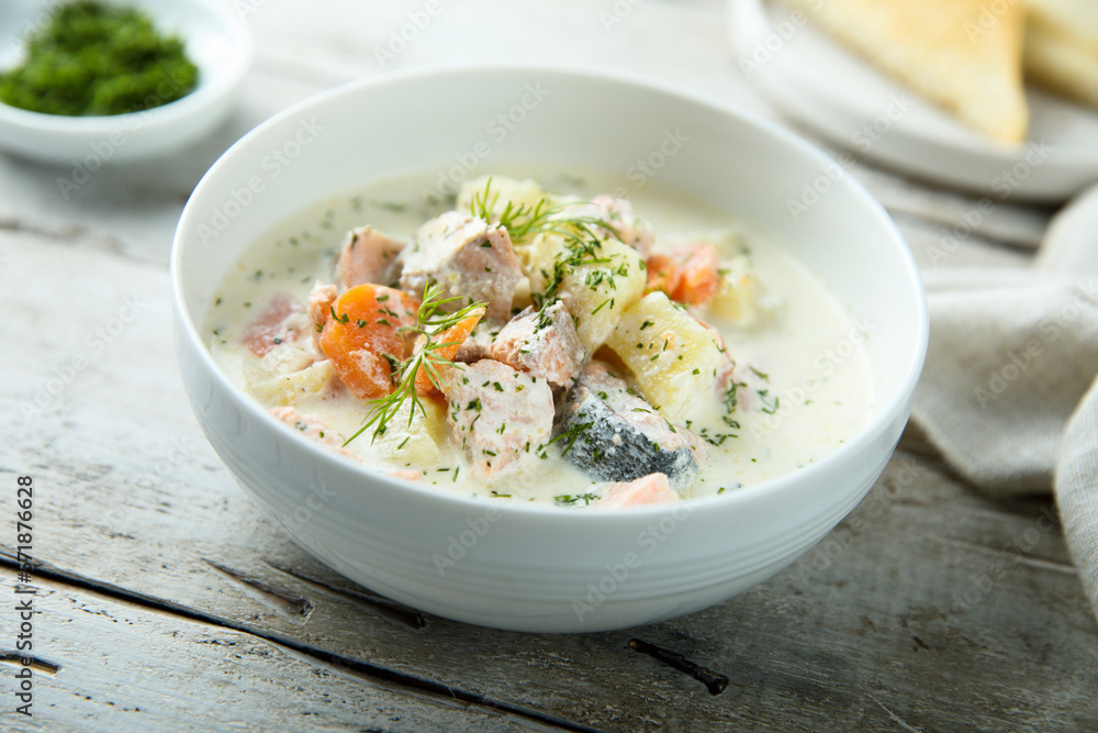 Traditional fish soup with vegetables and cream