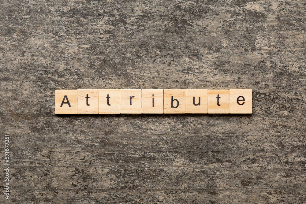 ATTRIBUTE word written on wood block. ATTRIBUTE text on cement table for your desing, concept ATTRIBUTE word written on wood block. ATTRIBUTE text on cement table for your desing, concept