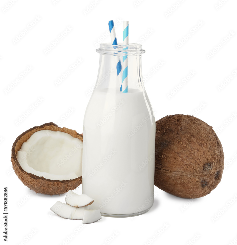 Glass bottle of delicious vegan milk and coconuts on white background Glass bottle of delicious vegan milk and coconuts on white background