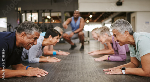 Foto Senior people, fitness and plank with personal trainer in class for workout, core exercise or training at gym