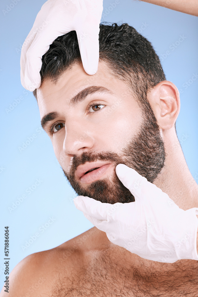 Obraz premium Face, plastic surgery and hands check man for laser, botox implant or beauty clinic. Skincare consultation, facial and gloves of aesthetic change, male cosmetics filler or body prp on blue background