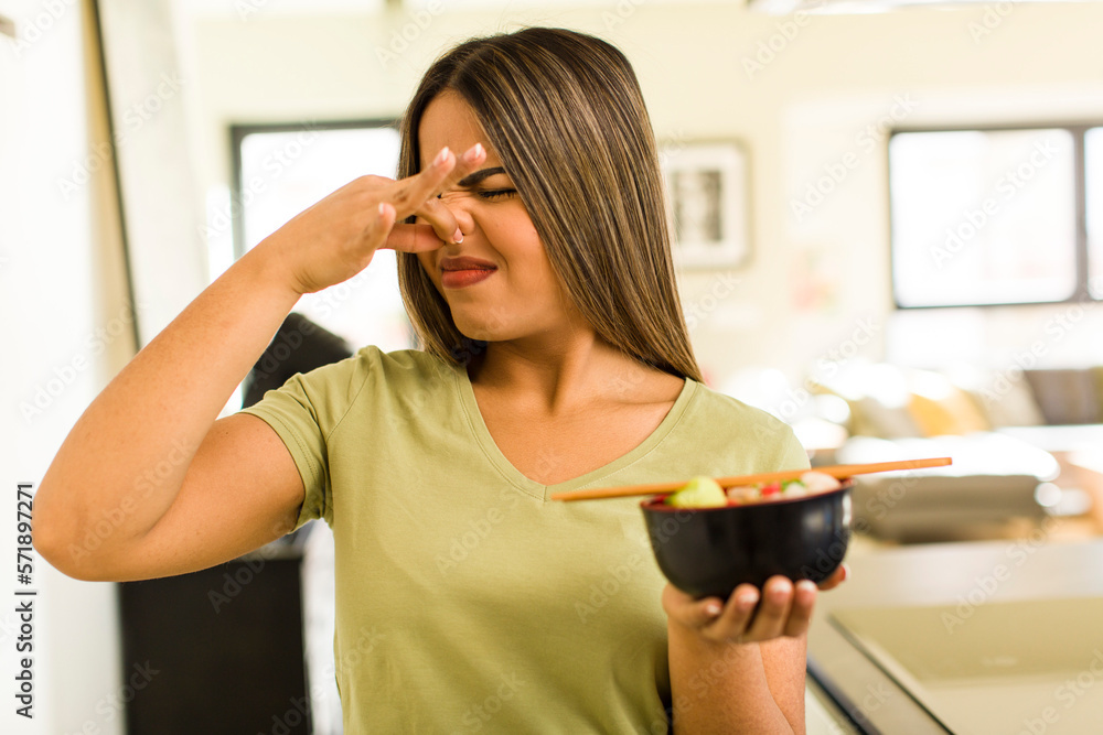 pretty latin woman having a ramen noodles bowl pretty latin woman having a ramen noodles bowl