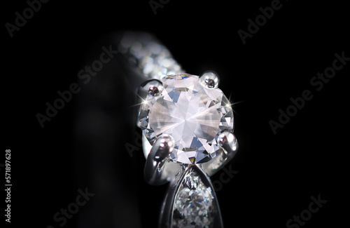 shiny diamond ring on black background