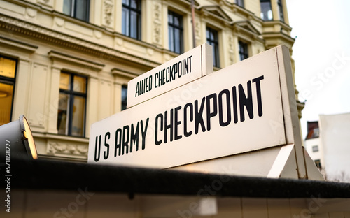 Signpost at Checkpoint Charlie. The crossing point between East and west Berlin, symbol of the Cold War. photo