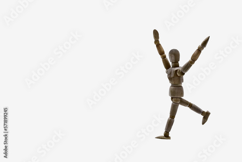 Photograph of a dark coloured wooden mannequin with smoke white coloured background. Photo to be able to crop. Concepts. Selective focus. Space for copy