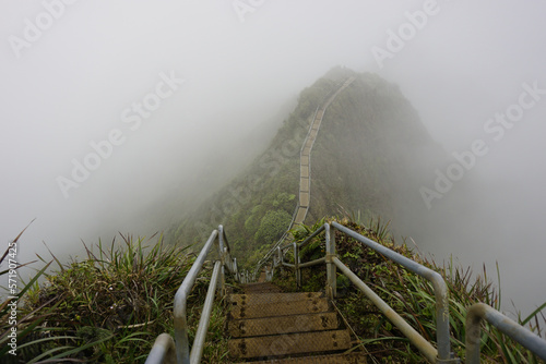 Haiku Stairs to heaven in clouds.  Known as Stairs to Heaven or Haiku Ladder. Steel step Structure  provide pedestrian access to CCL Bunker at the top of Koolau mountain in Oahu island in Hawaii