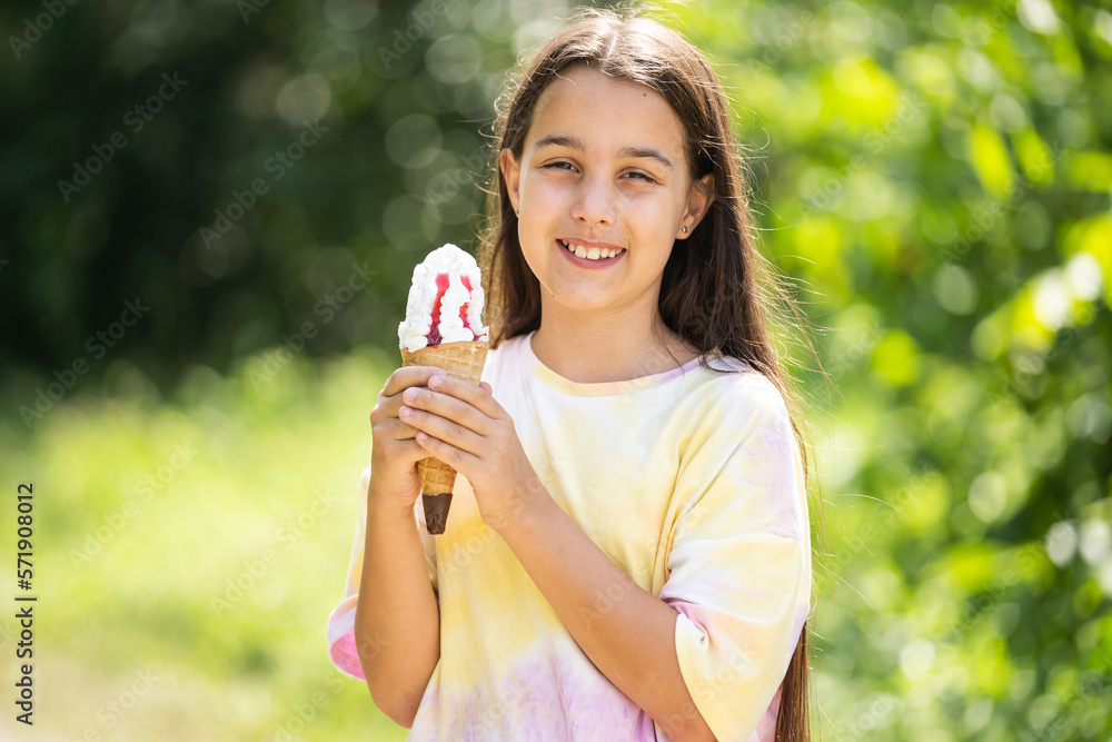 Pretty little girl eating an ice cream outdoors. Pretty little girl eating an ice cream outdoors.