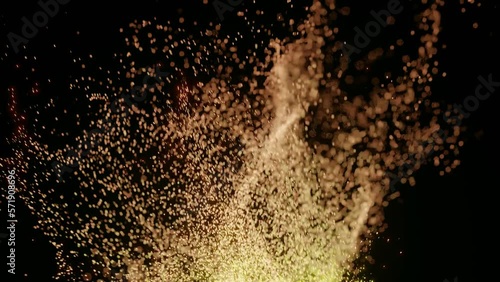 オレンジ色の幻想的なパーティクル　粒子　液体　小さい粒が舞う　