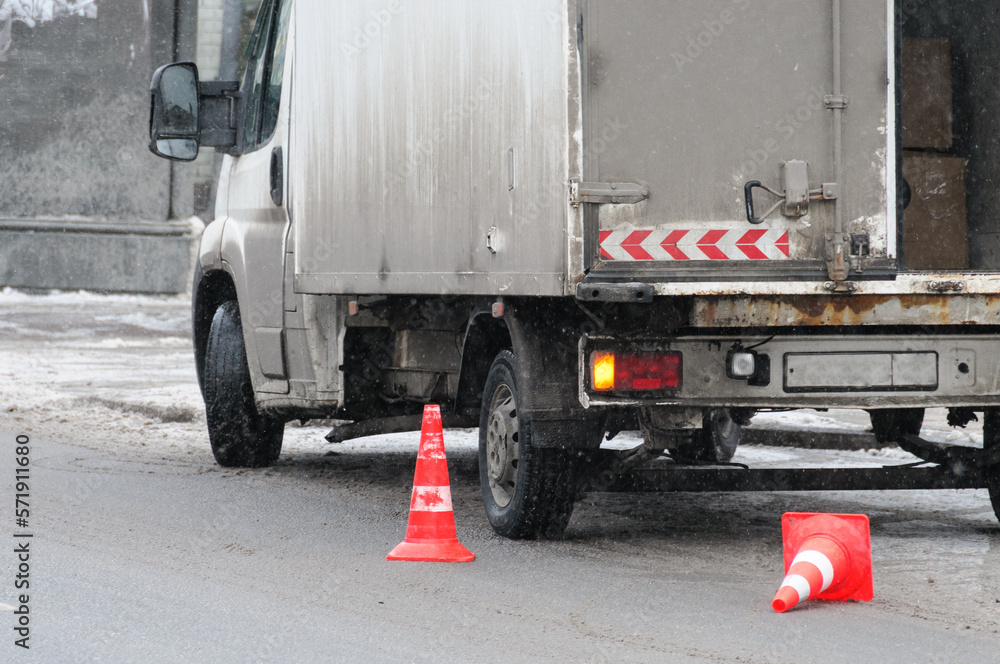 Car marked with cones on the road, unloading Car marked with cones on the road, unloading