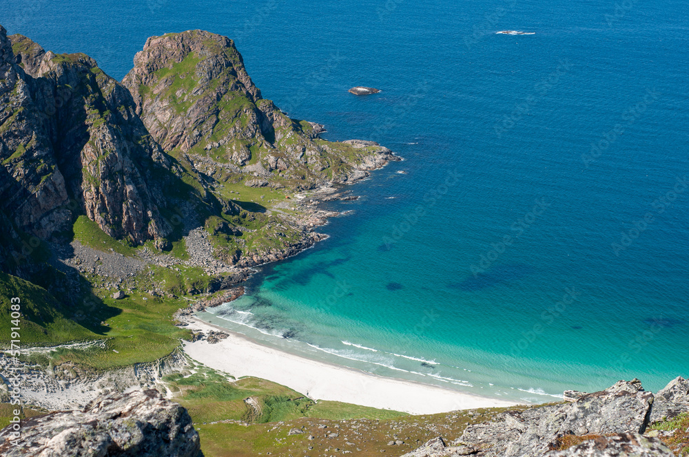 Remote private beach on North Norway. Turquoise water, fjord, mountain. View from above