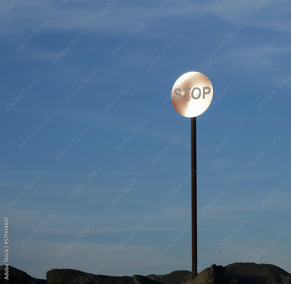 red roundabout crossroad road traffic sign with STOP sign against blue cloudy sky. red roundabout crossroad road traffic sign with STOP sign against blue cloudy sky.