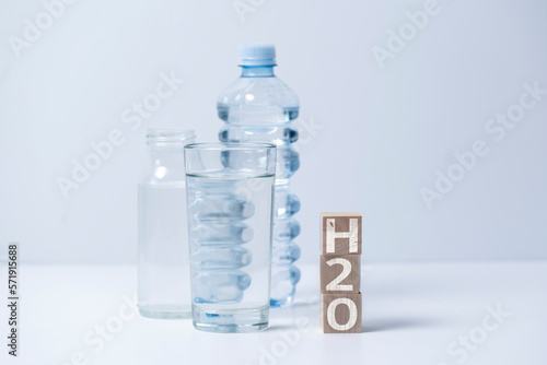 fresh pure drinking water, wooden cubes with h2o text