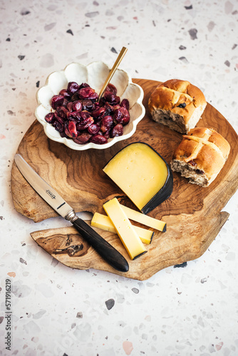 Easter breakfast of hot cross buns with mature gouda cheese and roasted grapes photo