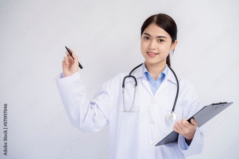 Medical concept of Asian female doctor in white coat with stethoscope and note board on white background Medical concept of Asian female doctor in white coat with stethoscope and note board on white background